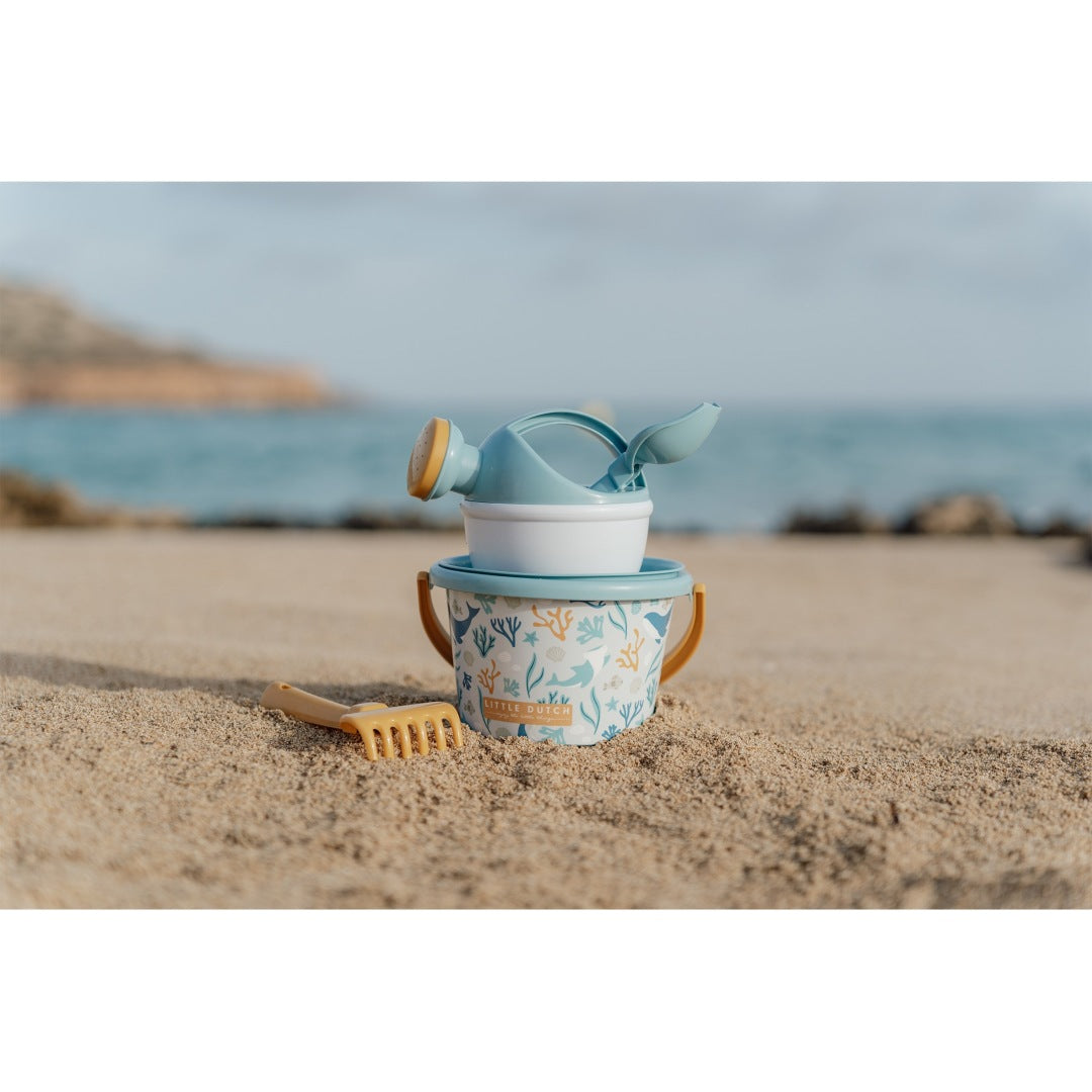 Beach set with bucket, watering can, rake, and shovel for children