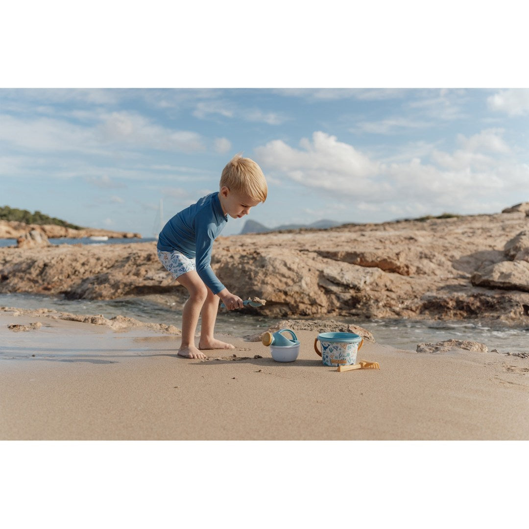 Beach set with bucket, watering can, rake, and shovel for children