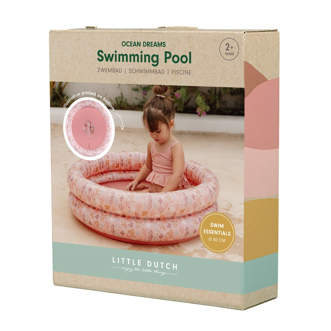 Verpackung des Kinder-Planschbeckens Ocean Dreams Pink mit 80 cm Durchmesser. Die Produktverpackung zeigt das aufblasbare Planschbecken für Babys und Kleinkinder mit maritimem Design für sommerlichen Wasserspaß.