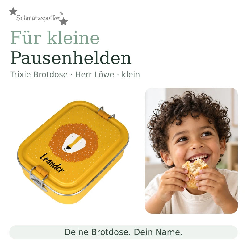 Trixie Brotdose Herr Löwe klein mit dem Namen Leander neben einem Kind bei der Snackpause