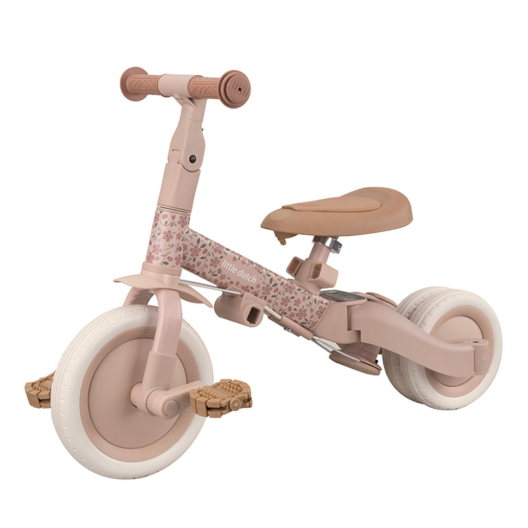 Mitwachsendes 4-in-1 Dreirad Fairy Floral Rosa im Laufrad-Modus für Kinder ab 1 Jahr. Hochwertiges Kinderfahrzeug mit verstellbarem Sattel, Pedalen und klappbarer Hinterachse zur Förderung von Gleichgewicht, Motorik und sicherem Fahrspaß.