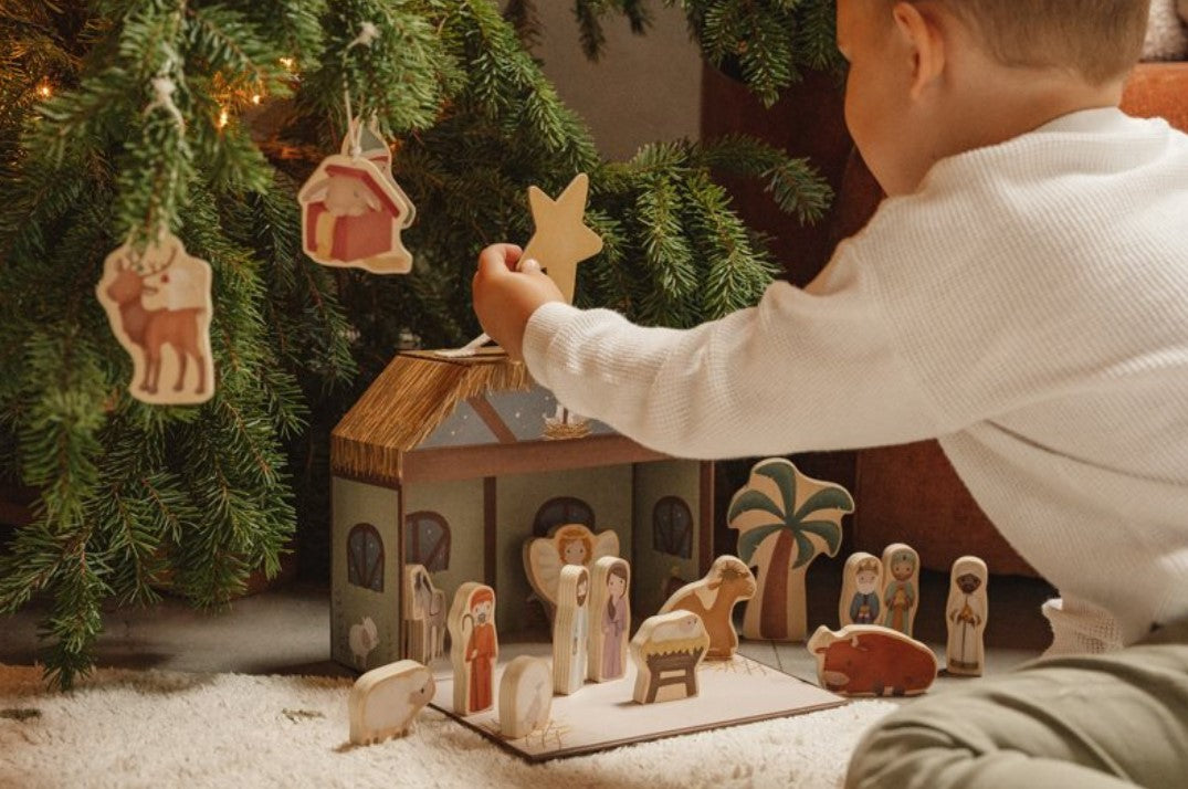 Christmas nativity scene with toy suitcase